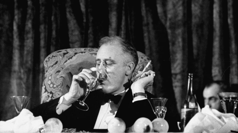 President Franklin Delano Roosevelt drinks a glass of wine at a fundraising dinner in 1938. FDR fancied himself quite the skilled mixologist; many of his colleagues disagreed